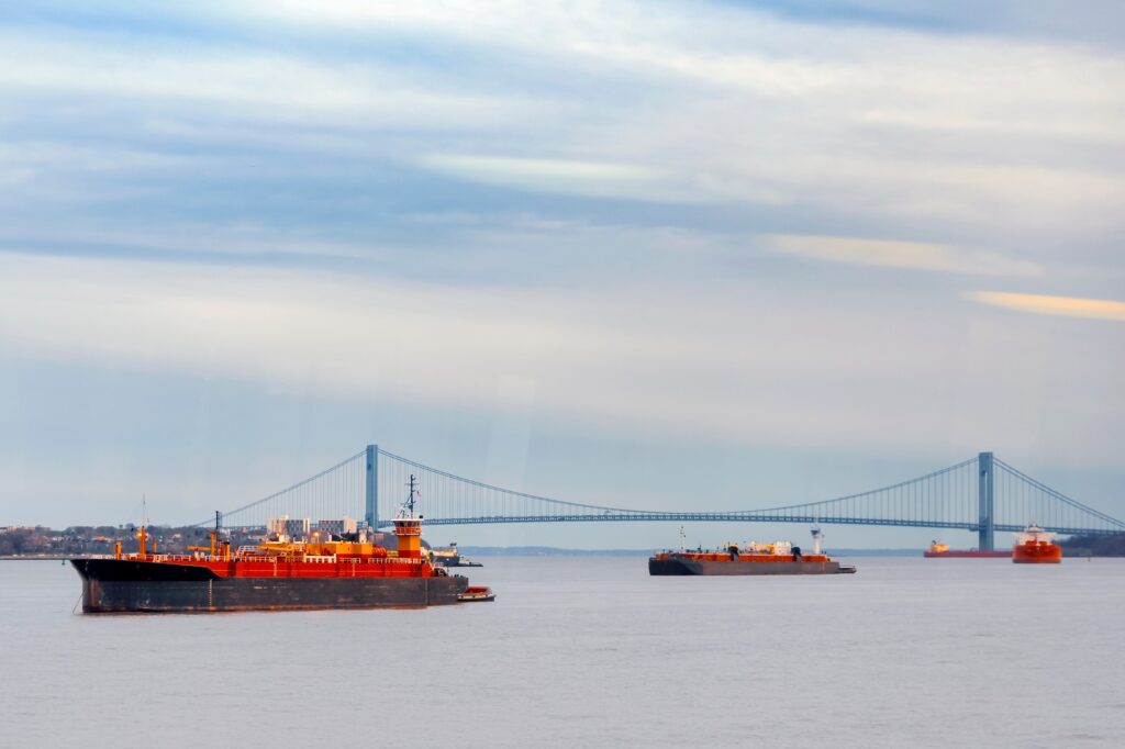 Cargo shipping container boats on Hudson Bay with bridge